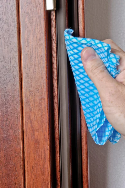 stock image Hand of man works on a window