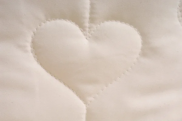 stock image Heart plush fabric background with staple