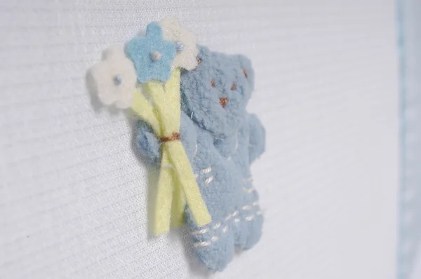Zımba ve çiçek oyuncak ayı peluş kumaş arka plan — Stok fotoğraf