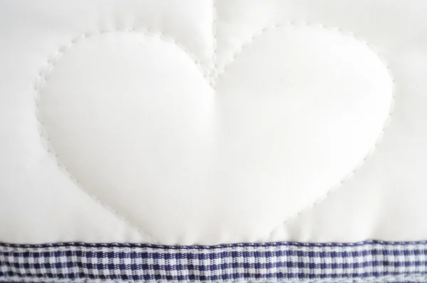 stock image Heart plush fabric background with staple