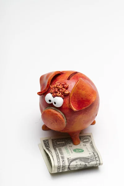 Piggy bank with $2 USD (portrait – bottom aligned) — Stock Photo, Image