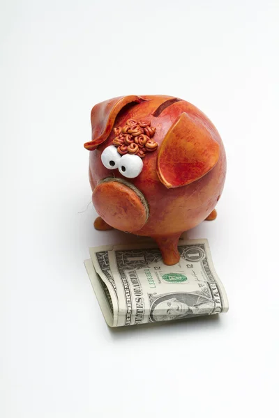 Piggy bank with $2 USD (portrait – center aligned) Stock Photo