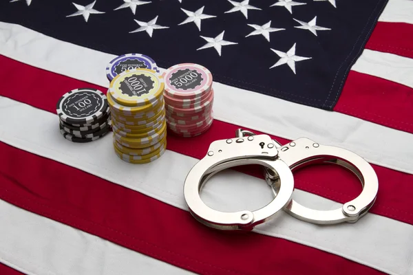 stock image US Flag with poker chips and handcuffs