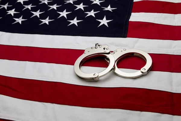 US Flag and Handcuffs Royalty Free Stock Photos