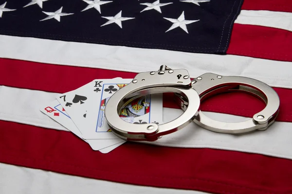 US Flag with handcuffs and cards Royalty Free Stock Photos