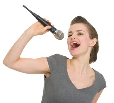 Cheerful woman singing in microphone isolated clipart