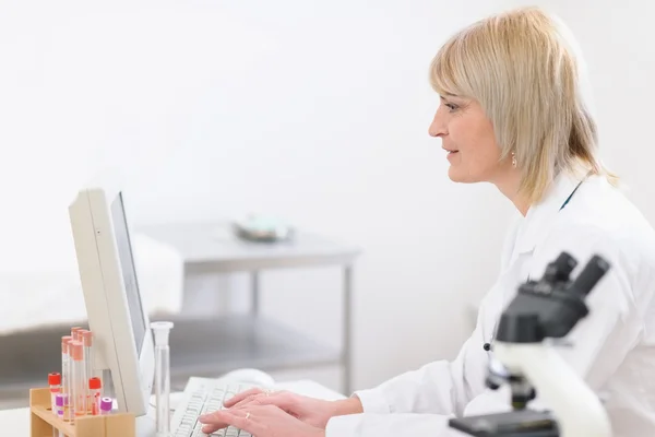 Middle age doctor woman working at laboratory — Stock Photo, Image