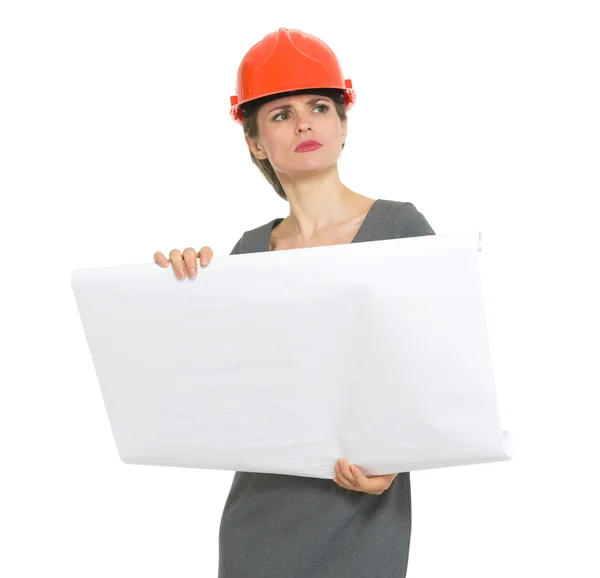 Authoritative architect woman with flipchart looking into distance — Stock Photo, Image