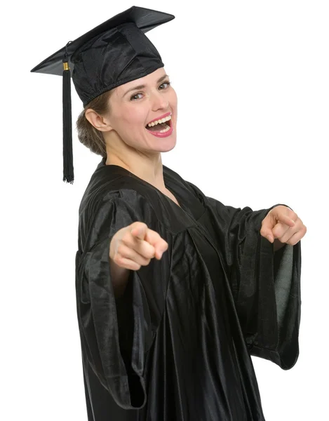 Smiling graduation student woman pointing on you isolated — Stock Photo, Image