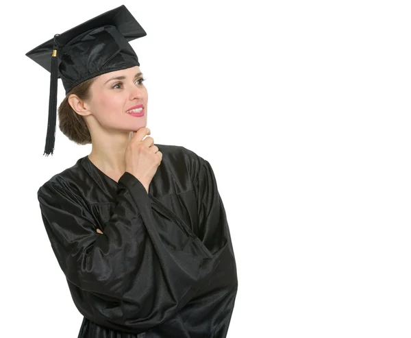 Pensativo graduación estudiante mujer buscando en el espacio de copia aislado — Foto de Stock