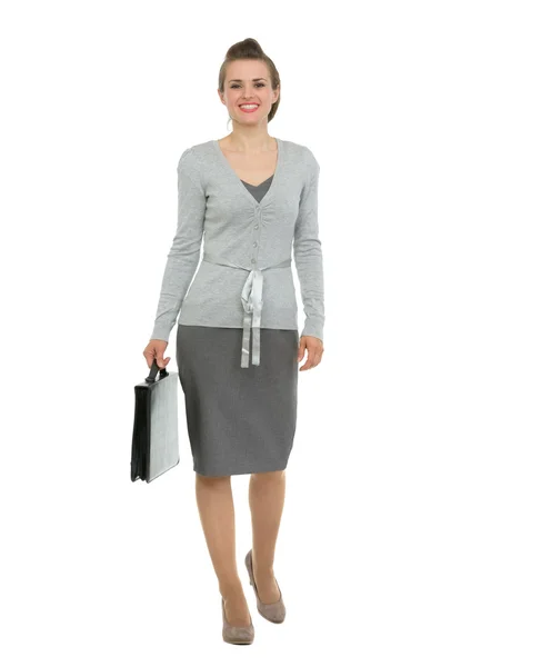Modern business woman with briefcase making step forward — Stock Photo, Image