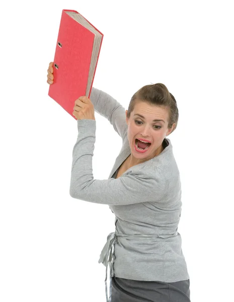 Angry business woman throwing folder in rage — Stock Photo, Image
