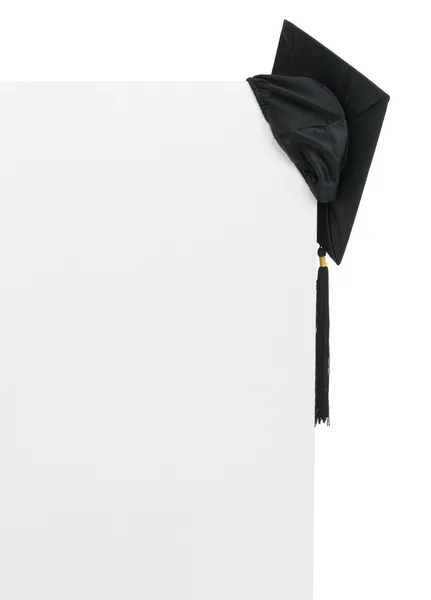 Graduation cap on blank billboard — Stock Photo, Image