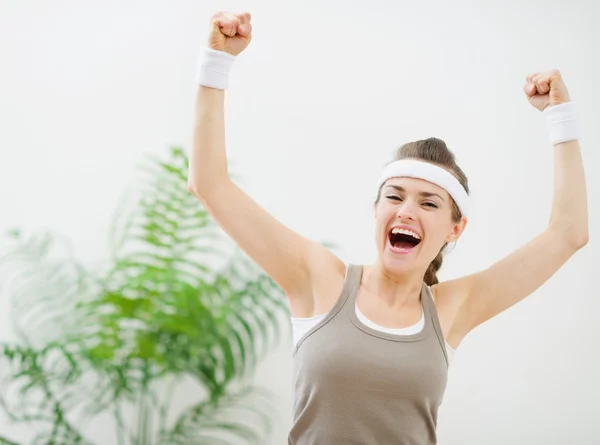 Happy sporty girl rejoicing success — Stock Photo, Image