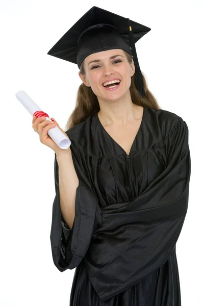 Smiling graduation female student holding diploma — Stock Photo, Image