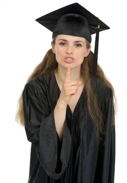 Sorrindo estudante de graduação menina mostrando shh gesto — Fotografia de Stock