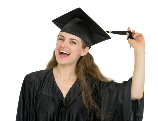 Menina estudante de graduação alegre jogando com borla — Fotografia de Stock