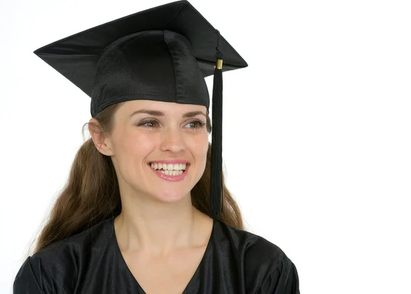 Portrait of smiling graduation girl looking on copy space — Stock Photo, Image
