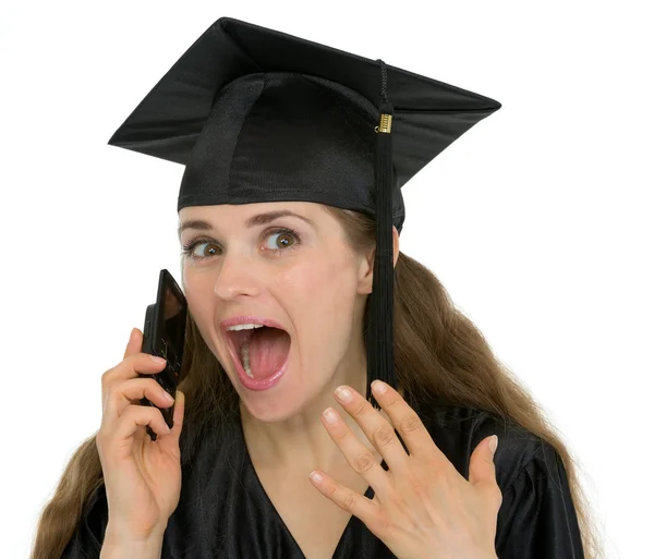 Portrait of excited graduation student girl speaking phone — Stock Photo, Image
