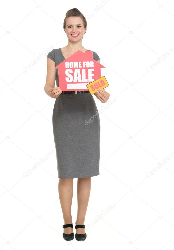 Smiling realtor with home for sale sold sign isolated