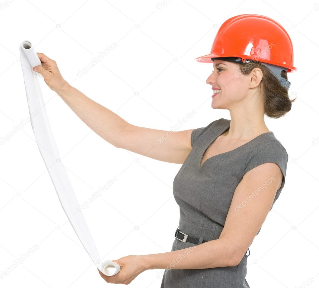 Happy architect woman looking on flipchart isolated