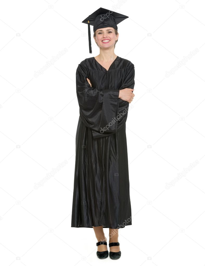 Full length portrait of woman in graduation cap and gown.