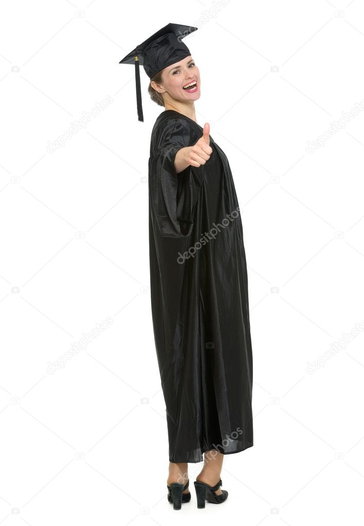 Full length portrait of graduation student woman showing thumbs up