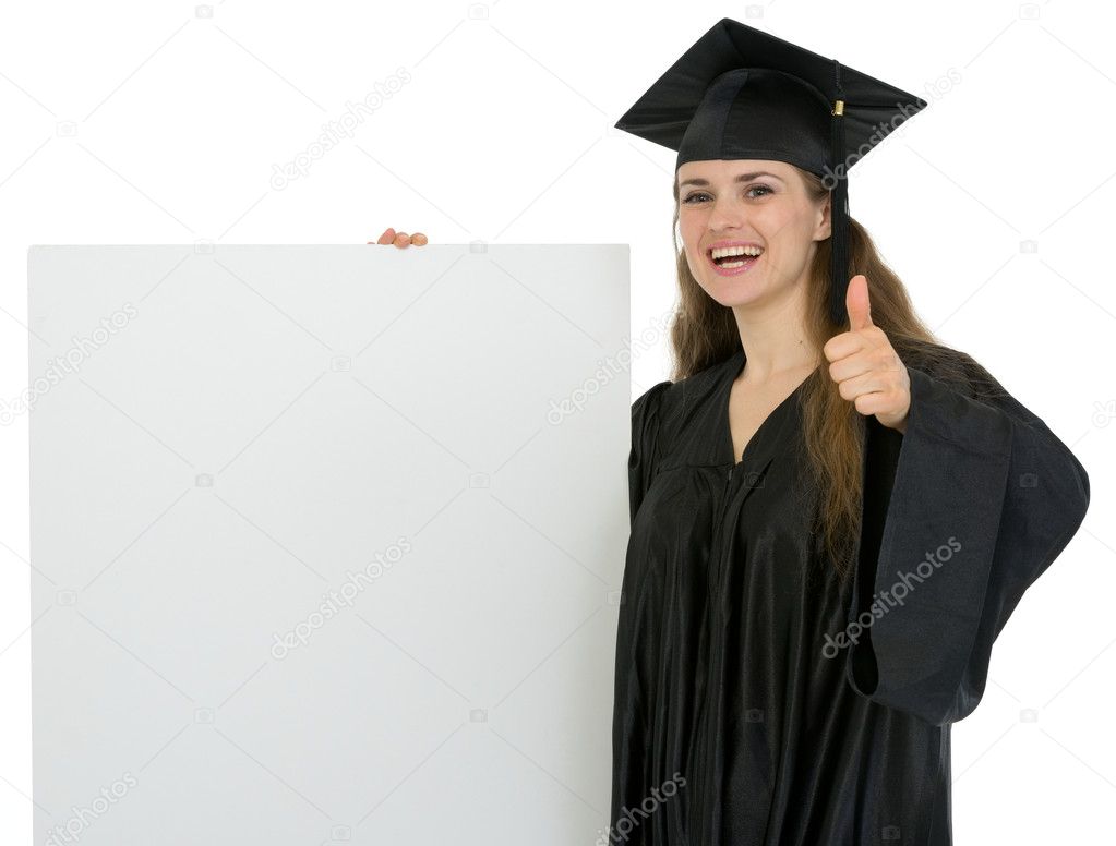 Happy graduation student girl holding blank billboard and showin