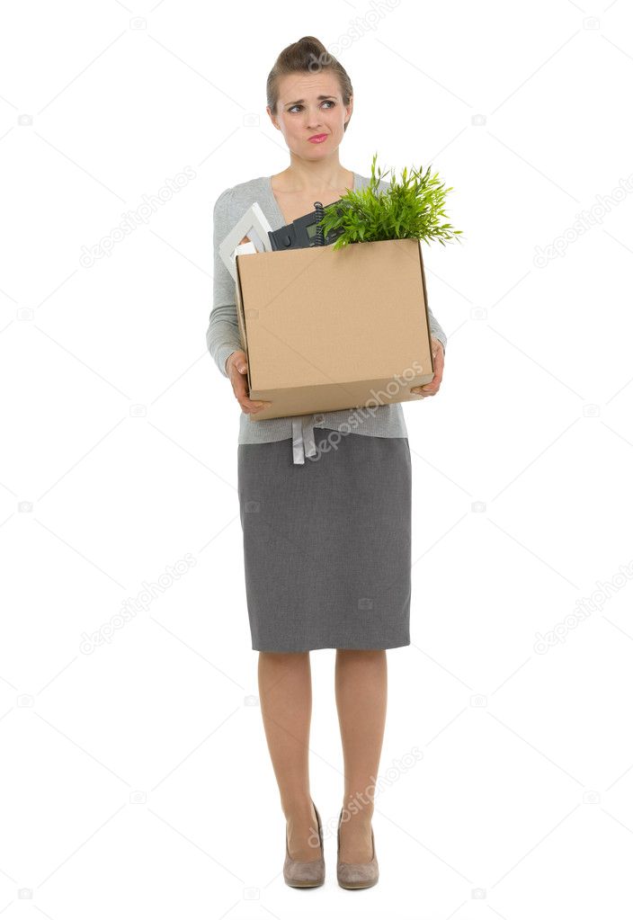Concerned woman employee holding box with personal items