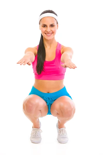 Fitness fille faisant squat exercice — Photo
