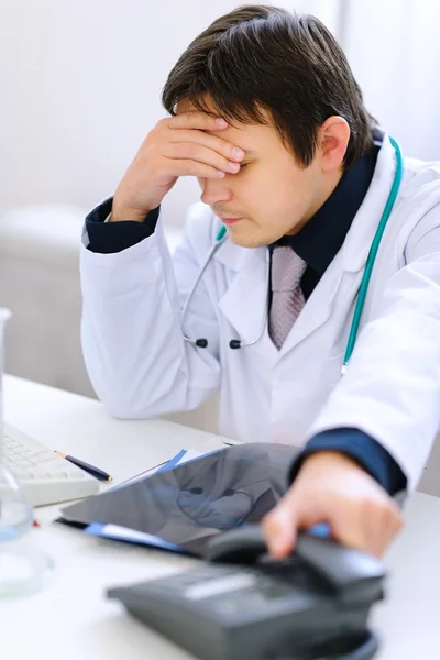 Sitting at office upset medical doctor just had bad phone call — Stock Photo, Image