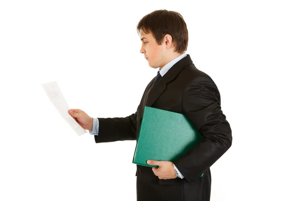 stock image Concentrated modern businessman holding folder and exploring documents