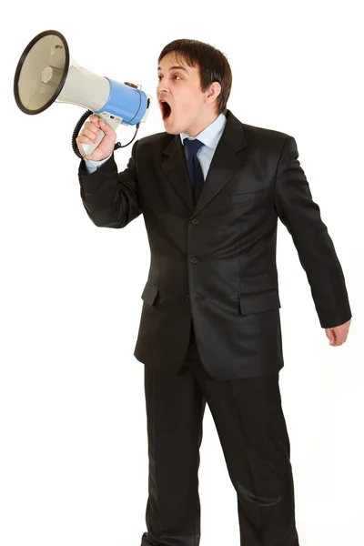 Frustrated young businessman yelling through megaphone — Stock Photo, Image