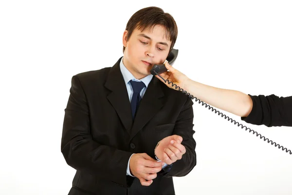 Elegant young businessman talking on phone in hand of secretary — Stock Photo, Image