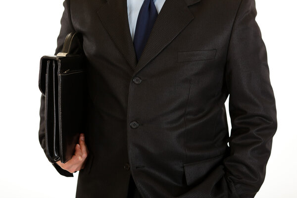 Businessman with briefcase in hand isolated on white. Close-up.