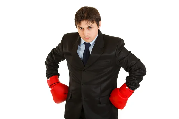 Vihainen nuori liikemies nyrkkeilyhanskat — kuvapankkivalokuva