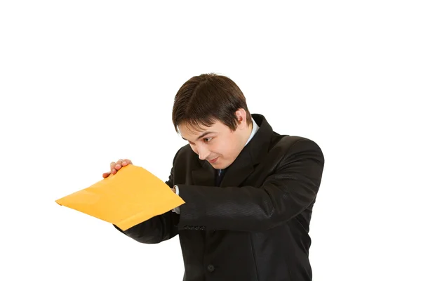 Interested young businessman checking parcel — Stock Photo, Image