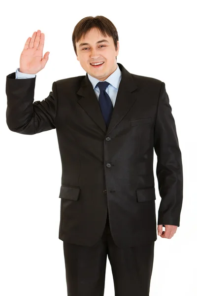 Amistoso hombre de negocios moderno mostrando gesto de saludo —  Fotos de Stock