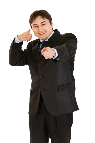 Sonriente joven hombre de negocios mostrando contacto conmigo gesto — Foto de Stock