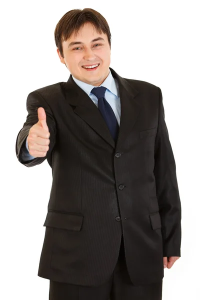 Lächelnder junger Geschäftsmann zeigt Daumen-hoch-Geste — Stockfoto