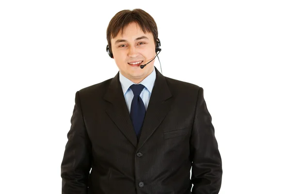 Homem de negócios moderno sorridente com fone de ouvido — Fotografia de Stock