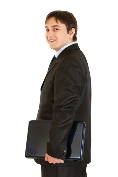 Sonriente hombre de negocios moderno con computadoras portátiles en la mano —  Fotos de Stock
