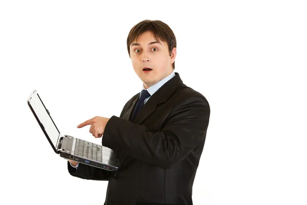 Modern businessman amazedly looks in laptops screen — Stock Photo, Image