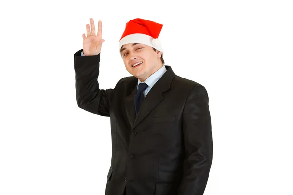 サンタ クロースの帽子でフレンドリーな若い実業家。新年あけましておめでとうございますと陽気な — ストック写真