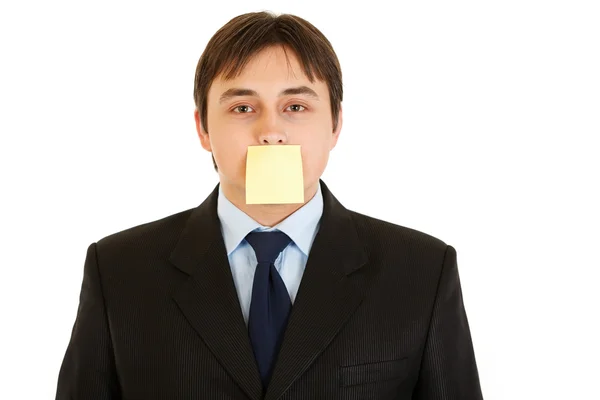 Young businessman with blank sticky note on his forehead — Stock Photo, Image