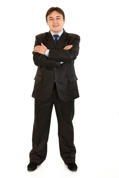 Elegante hombre de negocios sonriente con brazos cruzados en el pecho —  Fotos de Stock