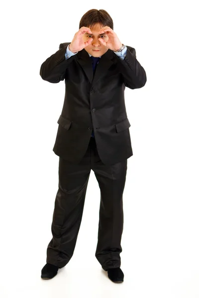 Full length portrait of interested businessman making binoculars with hands — Stock Photo, Image