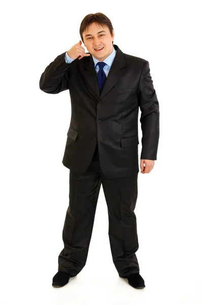 Full length portrait of smiling businessman showing contact me gesture — Stock Photo, Image