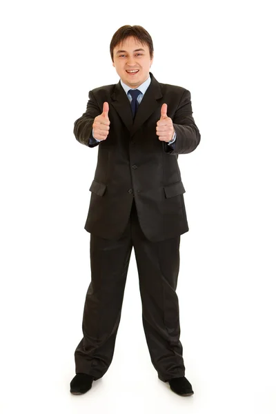 Full längd porträtt av leende affärsman visar tummen upp gest — Stockfoto