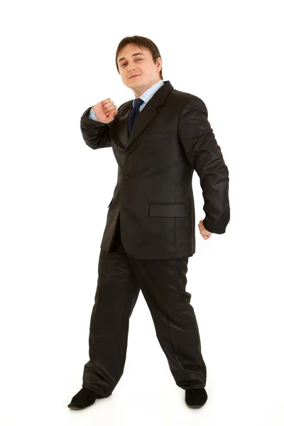 Full length portrait of pleased young businessman cheerfully dancing — Stock Photo, Image